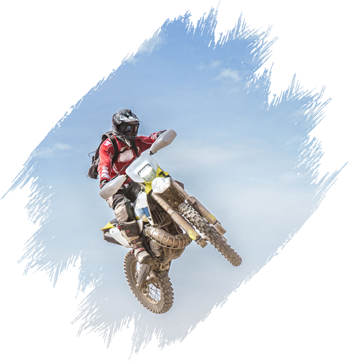 Off-road motorcycle stunt against sky